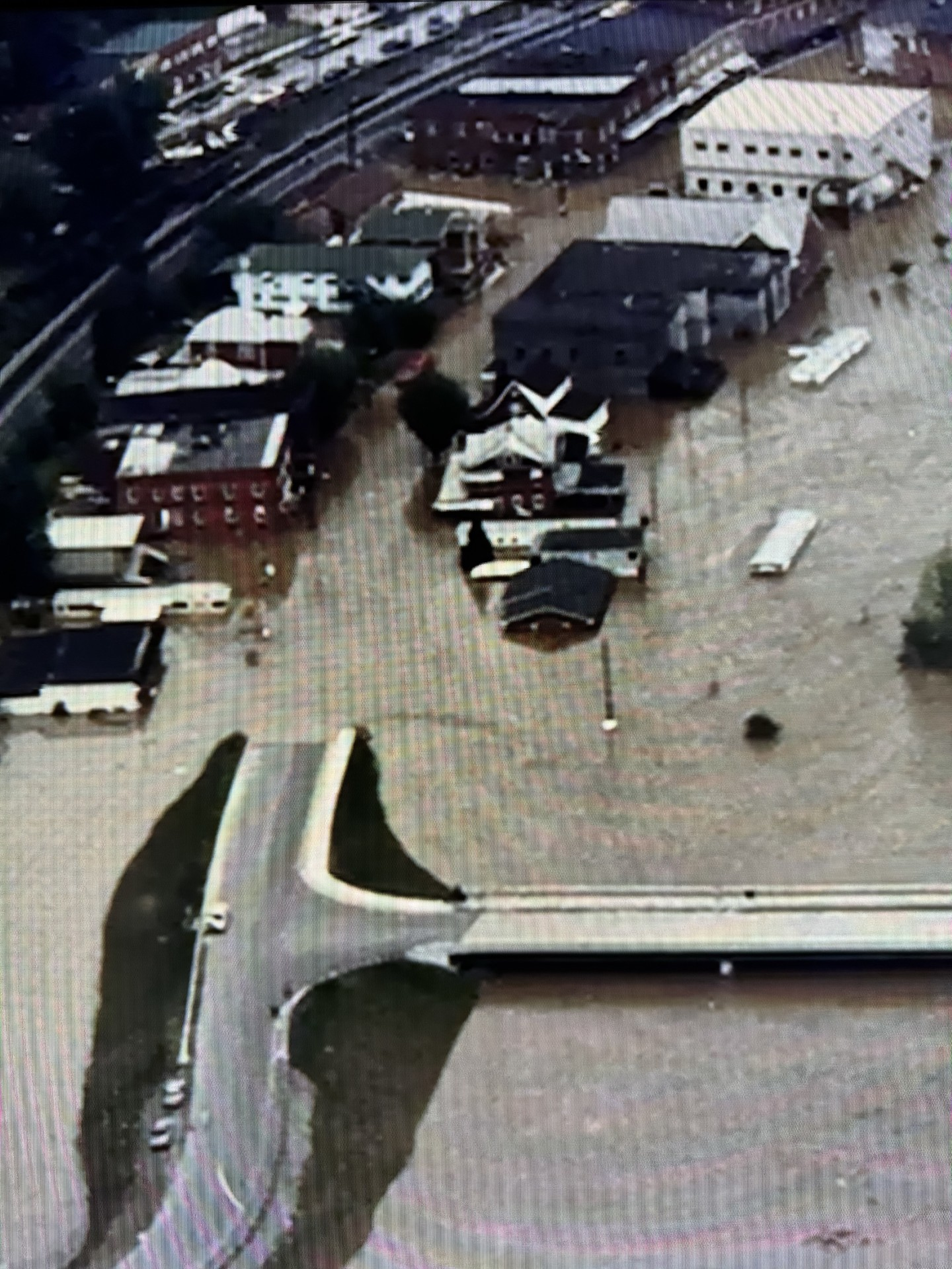 Aerial photograph of downtown Matewan West Virginia during the 1977 flood loading=