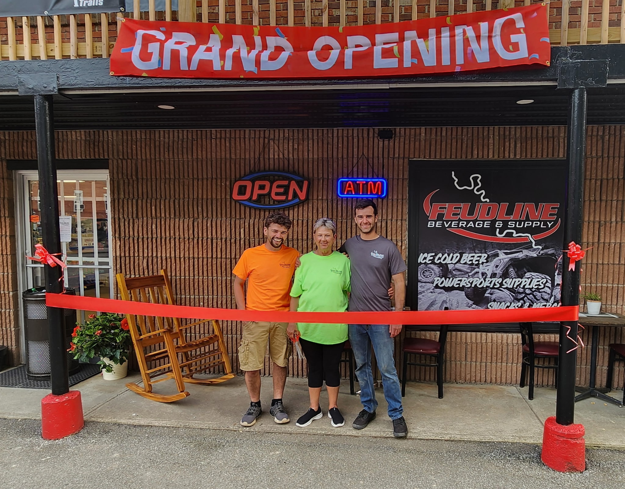 FeudLine owners with store manager at the grand opening