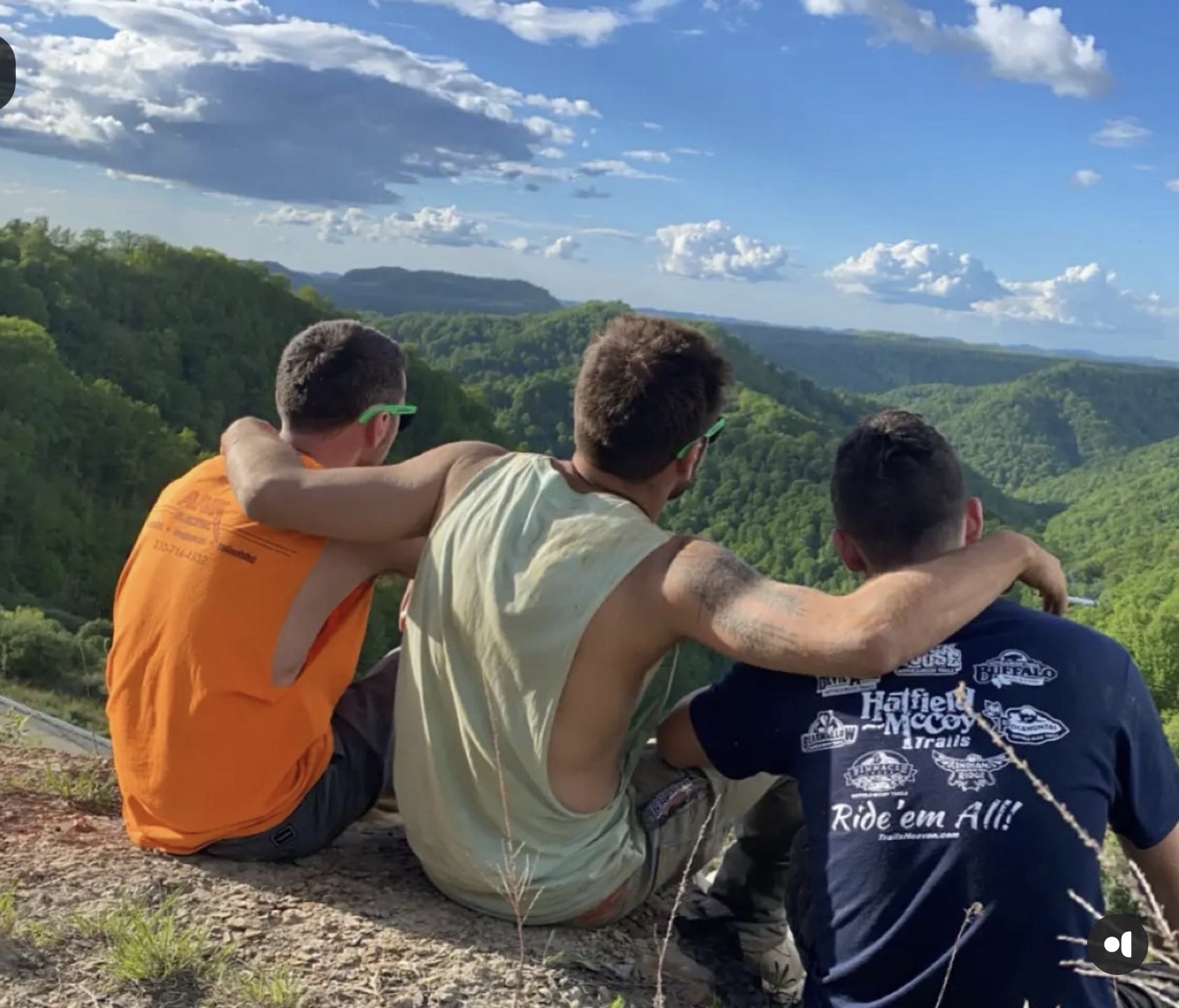 Friends overlooking the West Virginia mountains during a Hatfield-McCoy Trails riding trip